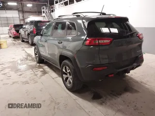 2015 Jeep Cherokee Trailhawk with VIN 1C4PJMBS6FW724931, listed as a IAAI auction lot 41602181 with 153,340 mi miles and . Bid and sale history available at carsss.com. Image 3.