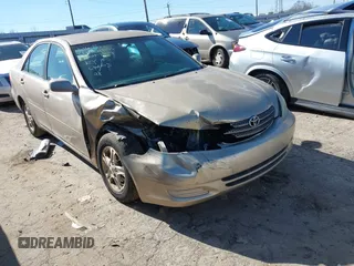 2002 Toyota Camry LE z VIN 4T1BE32K02U051709, wystawiony jako IAAI lot #41485620 z przebiegiem 232 876 mil mil oraz . Historia ofert i sprzedaży dostępna na DreamBid. Obrazek 6.