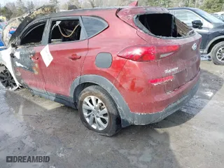 2019 Hyundai Tucson SE with VIN KM8J23A46KU962778, listed as a IAAI auction lot 41654534 with 98,000 mi miles. Bid and sale history available at carsss.com. Image 3.