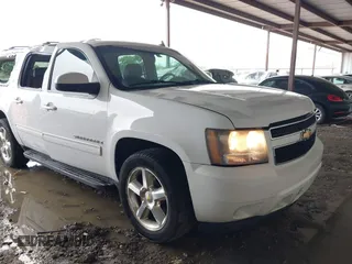 2009 Chevrolet Suburban 2LT z VIN 1GNFC26069R253019, wystawiony jako IAAI lot #42331124 z przebiegiem 251 716 mil mil oraz . Historia ofert i sprzedaży dostępna na DreamBid. Obrazek 1.