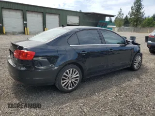 2014 Volkswagen Jetta SEL with VIN 3VWL17AJ2EM440524, listed as a Copart auction lot 61206685 with 104,987 mi miles and Salvage title. Bid and sale history available at DreamBid. Image 3.