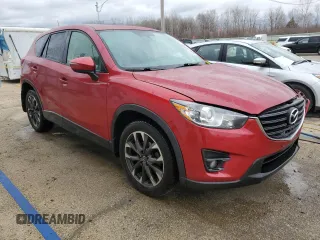 2016 Mazda CX-5 Grand Touring with VIN JM3KE4DY9G0771088, listed as a Copart auction lot 50615495 with 93,221 mi miles and Salvage Title. Bid and sale history available at DreamBid. Image 4.