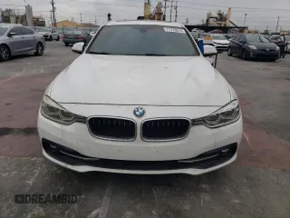 2018 BMW 3 Series 330i with VIN WBA8B9G57JNU57523, listed as a Copart auction lot 71773014 with 66,035 mi miles and Salvage Title. Bid and sale history available at carsss.com. Image 5.