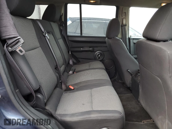 2010 Jeep Commander Sport with VIN 1J4RG4GK5AC119433, listed as a Copart auction lot 87657265 with 212,973 mi miles and Salvage title. Bid and sale history available at DreamBid. Image 11.