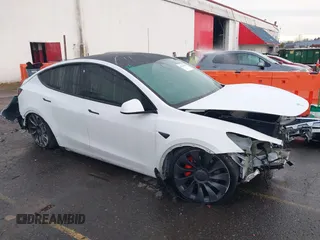 2021 Tesla Model Y Performance z VIN 5YJYGDEF2MF133739, wystawiony jako IAAI lot #41226429 z przebiegiem 58 502 mil mil oraz . Historia ofert i sprzedaży dostępna na DreamBid. Obrazek 1.