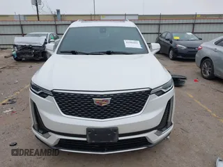 2021 Cadillac XT6 Premium Luxury z VIN 1GYKPCRSXMZ169206, wystawiony jako IAAI lot #41581841 z przebiegiem 64 789 mil mil oraz . Historia ofert i sprzedaży dostępna na DreamBid. Obrazek 12.