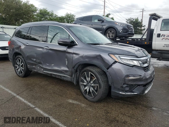 2020 Honda Pilot Touring 7-Passenger z VIN 5FNYF6H68LB052379, wystawiony jako Copart lot #57655775 z przebiegiem 73 501 mil mil oraz Szkoda całkowita • Salvage title. Historia ofert i sprzedaży dostępna na DreamBid. Obrazek 4.