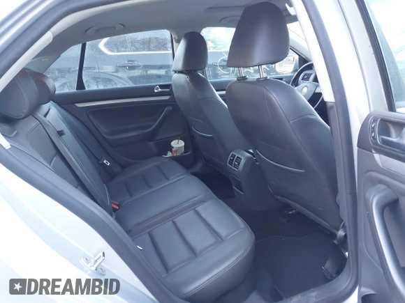 2009 Volkswagen Jetta Wolfsburg Edition with VIN 3VWRJ71K19M027857, listed as a IAAI auction lot 41312413 with 150,335 mi miles and . Bid and sale history available at DreamBid. Image 8.