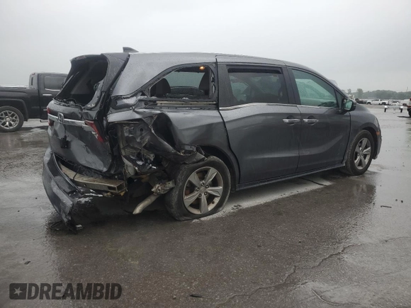2018 Honda Odyssey EX with VIN 5FNRL6H50JB047999, listed as a Copart auction lot 57819495 with 121,295 mi miles and Salvage title. Bid and sale history available at DreamBid. Image 3.