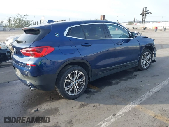 2020 BMW X2 sDrive28i with VIN WBXYH9C02L5P01502, listed as a IAAI auction lot 41397416 with 82,660 mi miles. Bid and sale history available at carsss.com. Image 4.