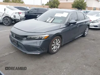 2023 Honda Civic Sedan LX with VIN 2HGFE2F29PH553494, listed as a IAAI auction lot 41895737 with 52,585 mi miles. Bid and sale history available at carsss.com. Image 2.
