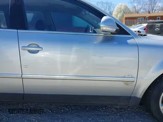 2005 Volkswagen Passat z VIN WVWDD63B25E110788, wystawiony jako IAAI lot #41877185 z przebiegiem 181 584 mil mil oraz . Historia ofert i sprzedaży dostępna na DreamBid. Obrazek 13.