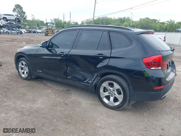 2014 BMW X1 sDrive28i with VIN WBAVM1C54EVW46561, listed as a IAAI auction lot 41880387 with 125,096 mi miles. Bid and sale history available at carsss.com. Image 3.