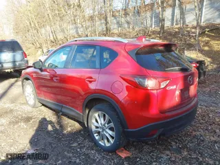2014 Mazda CX-5 Grand Touring with VIN JM3KE2DY1E0380423, listed as a IAAI auction lot 41854206 with 129,763 mi miles. Bid and sale history available at carsss.com. Image 3.