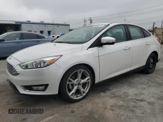 2015 Ford Focus Titanium z VIN 1FADP3J24FL324841, wystawiony jako Copart lot #59808175 z przebiegiem 27 532 mil mil oraz Szkoda całkowita • Salvage title. Historia ofert i sprzedaży dostępna na DreamBid. Obrazek 1.