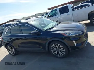 2020 Ford Escape Titanium Hybrid with VIN 1FMCU0DZ9LUC08090, listed as a IAAI auction lot 41674697 with 43,586 mi miles and . Bid and sale history available at DreamBid. Image 13.