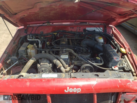 1999 Jeep Cherokee Sport z VIN 1J4FF68SXXL662401, wystawiony jako Copart lot #59698565 z przebiegiem Nie podano mil oraz Szkoda całkowita • Salvage title. Historia ofert i sprzedaży dostępna na DreamBid. Obrazek 11.