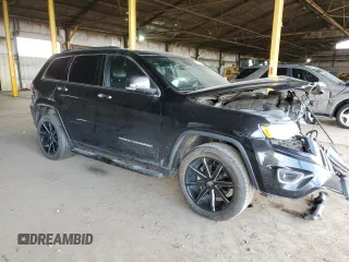 2015 Jeep Grand Cherokee Limited with VIN 1C4RJEBG7FC217855, listed as a Copart auction lot 50642135 with 124,130 mi miles and Salvage Title. Bid and sale history available at carsss.com. Image 4.