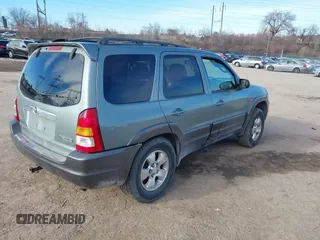 2003 Mazda Tribute ES with VIN 4F2CZ96133KM29066, listed as a IAAI auction lot 41581210 with 265,586 mi miles. Bid and sale history available at carsss.com. Image 4.