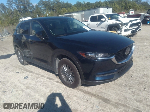 2020 Mazda CX-5 Touring with VIN JM3KFACM1L1817303, listed as a IAAI auction lot 41627859 with 57,268 mi miles. Bid and sale history available at carsss.com. Image 1.