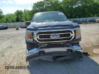 2021 Ford F-150 XL with VIN 1FTFW1E5XMFA47980, listed as a Copart auction lot 56737215 with 63,781 mi miles and Salvage title. Bid and sale history available at DreamBid. Image 13.