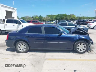 2005 Chrysler 300 with VIN 2C3JA53G25H167944, listed as a IAAI auction lot 41963114 with 196,635 mi miles. Bid and sale history available at carsss.com. Image 14.