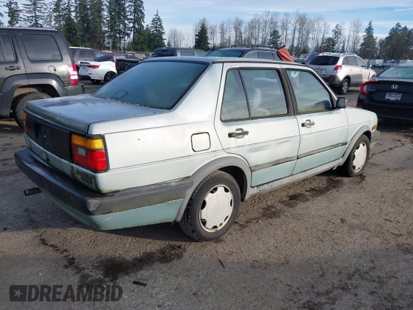 1991 Volkswagen Jetta z VIN 3VWRB21G1MM017401, wystawiony jako IAAI lot #41018295 z przebiegiem 206 316 mil mil oraz . Historia ofert i sprzedaży dostępna na DreamBid. Obrazek 4.