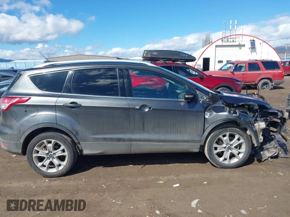 2016 Ford Escape Titanium with VIN 1FMCU9J96GUB96009, listed as a IAAI auction lot 41866127 with 132,990 mi miles and . Bid and sale history available at DreamBid. Image 14.