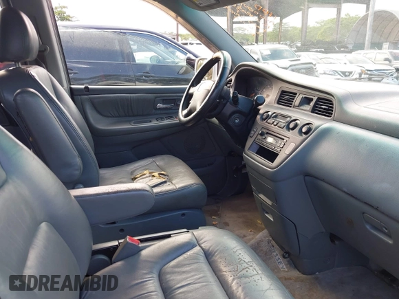 2004 Honda Odyssey EX-L with VIN 5FNRL18924B064040, listed as a IAAI auction lot 41350306 with 130,803 mi miles and . Bid and sale history available at DreamBid. Image 5.