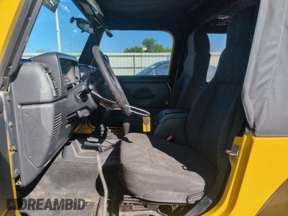 2004 Jeep Wrangler Sport z VIN 1J4FA49S64P751615, wystawiony jako Copart lot #55810895 z przebiegiem 128 165 mil mil oraz Szkoda całkowita • Salvage title. Historia ofert i sprzedaży dostępna na DreamBid. Obrazek 7.