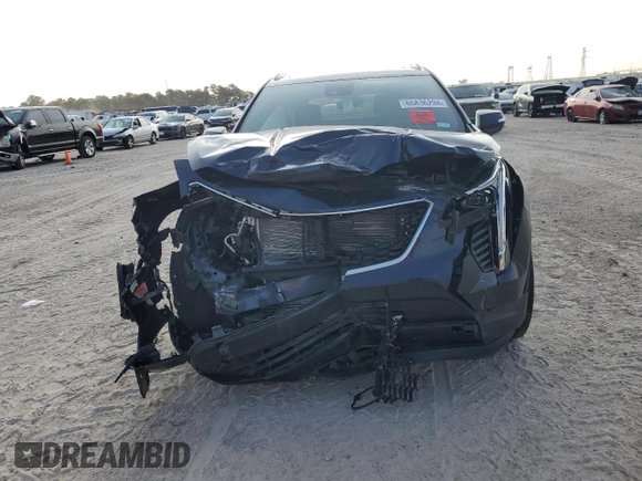 2022 Cadillac XT4 FWD Sport z VIN 1GYFZER45NF156035, wystawiony jako Copart lot #65836294 z przebiegiem 62 443 mil mil oraz Szkoda całkowita • Salvage title. Historia ofert i sprzedaży dostępna na DreamBid. Obrazek 5.