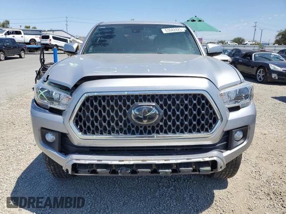 2018 Toyota Tacoma SR with VIN 3TMCZ5AN6JM129370, listed as a Copart auction lot 63042425 with 65,189 mi miles and Salvage title. Bid and sale history available at DreamBid. Image 5.