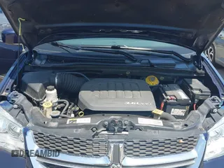 2014 Dodge Grand Caravan SXT with VIN 2C4RDGCG3ER266199, listed as a IAAI auction lot 42119064 with 148,067 mi miles and . Bid and sale history available at DreamBid. Image 10.