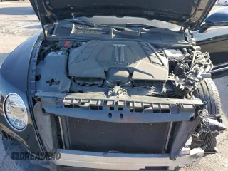 2019 Bentley Bentayga V8 z VIN SJAAM2ZV5KC024154, wystawiony jako Copart lot #74990344 z przebiegiem 41 589 mil mil oraz Szkoda całkowita • Salvage title. Historia ofert i sprzedaży dostępna na DreamBid. Obrazek 12.