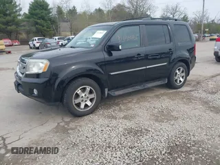 2009 Honda Pilot Touring with VIN 5FNYF48969B055806, listed as a IAAI auction lot 42138651 with 253,623 mi miles and . Bid and sale history available at carsss.com. Image 2.