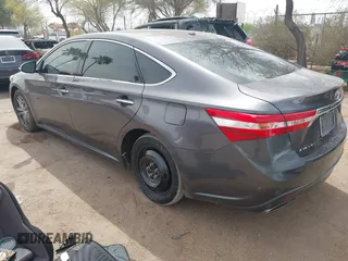 2014 Toyota Avalon Limited with VIN 4T1BK1EB1EU101787, listed as a IAAI auction lot 41949977 with 137,837 mi miles. Bid and sale history available at carsss.com. Image 3.