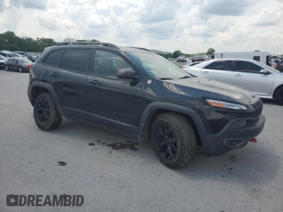 2015 Jeep Cherokee Trailhawk with VIN 1C4PJMBS7FW577826, listed as a Copart auction lot 54933105 with 163,751 mi miles and Clean title. Bid and sale history available at DreamBid. Image 4.
