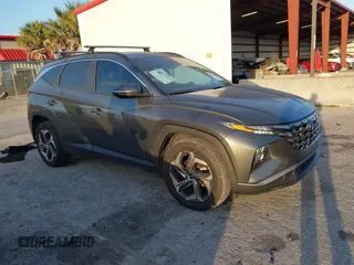 2022 Hyundai Tucson SEL z VIN 5NMJCCAE0NH149457, wystawiony jako IAAI lot #42166988 z przebiegiem 51 930 mil mil oraz . Historia ofert i sprzedaży dostępna na DreamBid. Obrazek 1.