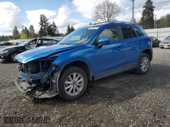 2014 Mazda CX-5 Touring with VIN JM3KE4CY3E0381134, listed as a Copart auction lot 52115015 with 52,162 mi miles and Salvage Title. Bid and sale history available at carsss.com. Image 1.