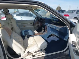 1989 Cadillac Eldorado with VIN 1G6EL1150KU621587, listed as a IAAI auction lot 42103841 with 129,711 mi miles and . Bid and sale history available at DreamBid. Image 5.