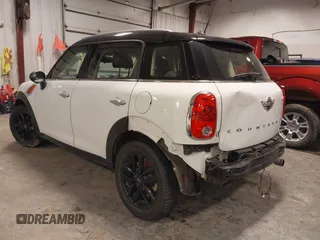 2014 MINI Countryman with VIN WMWZB3C57EWR42476, listed as a IAAI auction lot 41716731 with 94,378 mi miles and . Bid and sale history available at DreamBid. Image 3.