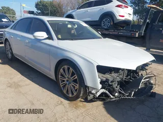 2014 Audi A8 3.0T z VIN WAURGAFDXEN006902, wystawiony jako IAAI lot #41099662 z przebiegiem 118 734 mil mil oraz . Historia ofert i sprzedaży dostępna na DreamBid. Obrazek 1.