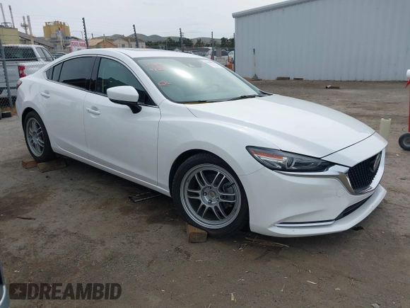 2018 Mazda 6 Grand Touring Reserve with VIN JM1GL1WYXJ1300116, listed as a IAAI auction lot 42088015 with 57,760 mi miles and . Bid and sale history available at DreamBid. Image 1.