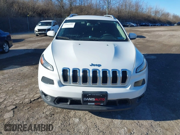 2015 Jeep Cherokee Latitude with VIN 1C4PJMCB3FW734573, listed as a IAAI auction lot 41825561 with 141,250 mi miles. Bid and sale history available at carsss.com. Image 13.