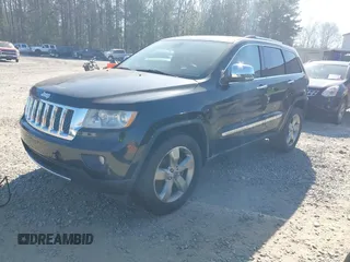 2013 Jeep Grand Cherokee Overland with VIN 1C4RJECG7DC644822, listed as a IAAI auction lot 41658872 with 156,838 mi miles. Bid and sale history available at carsss.com. Image 2.