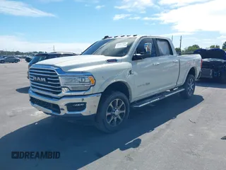 2020 Ram 2500 Longhorn with VIN 3C6UR5GL6LG230556, listed as a IAAI auction lot 38787704 with Not provided miles and . Bid and sale history available at DreamBid. Image 2.