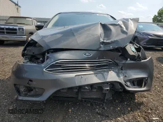 2018 Ford Focus Titanium z VIN 1FADP3N20JL271719, wystawiony jako Copart lot #60784755 z przebiegiem 116 118 mil mil oraz Szkoda całkowita • Salvage title. Historia ofert i sprzedaży dostępna na DreamBid. Obrazek 5.