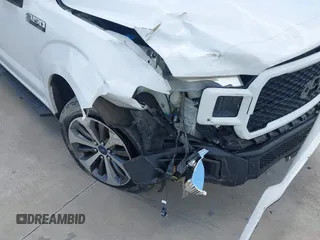 2019 Ford F-150 XL with VIN 1FTEW1CP5KKE62001, listed as a IAAI auction lot 42611277 with 207,262 mi miles and . Bid and sale history available at DreamBid. Image 6.