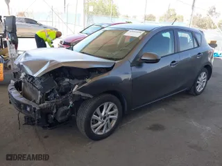 2012 Mazda Mazda3 i Touring with VIN JM1BL1L89C1679045, listed as a IAAI auction lot 42001894 with 151,233 mi miles. Bid and sale history available at carsss.com. Image 2.