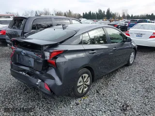 2021 Toyota Prius L Eco with VIN JTDKAMFU2M3143138, listed as a IAAI auction lot 41658263 with 102,718 mi miles. Bid and sale history available at carsss.com. Image 4.